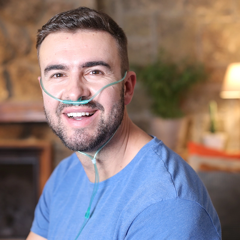 smiling man with oxygen